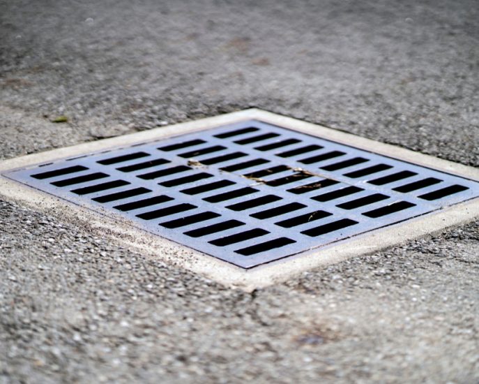 Water Drain on Cement Road — Blocked Drain Services In Helensvale, QLD