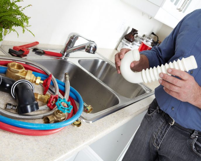 Plumber with a wrench — Blocked Drain Services In Coolangatta, QLD